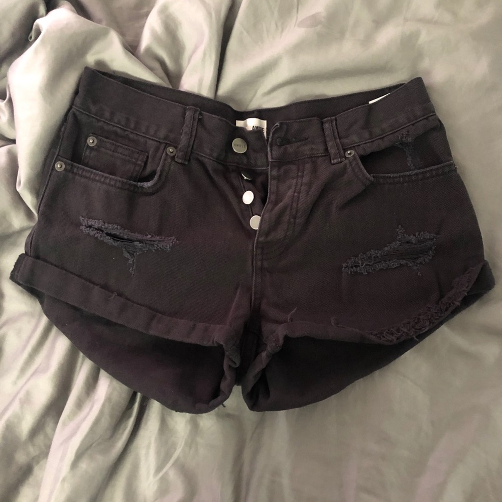 black distressed denim shorts.